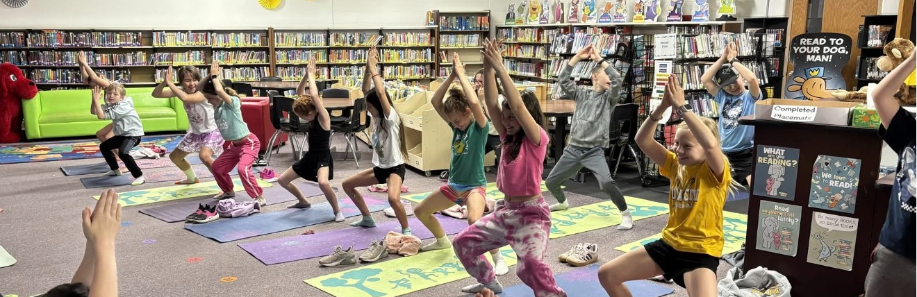 Students doing yoga in library