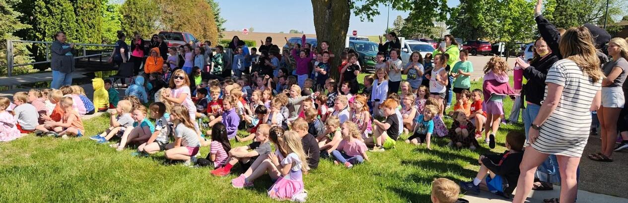 Students at picnic under tree
